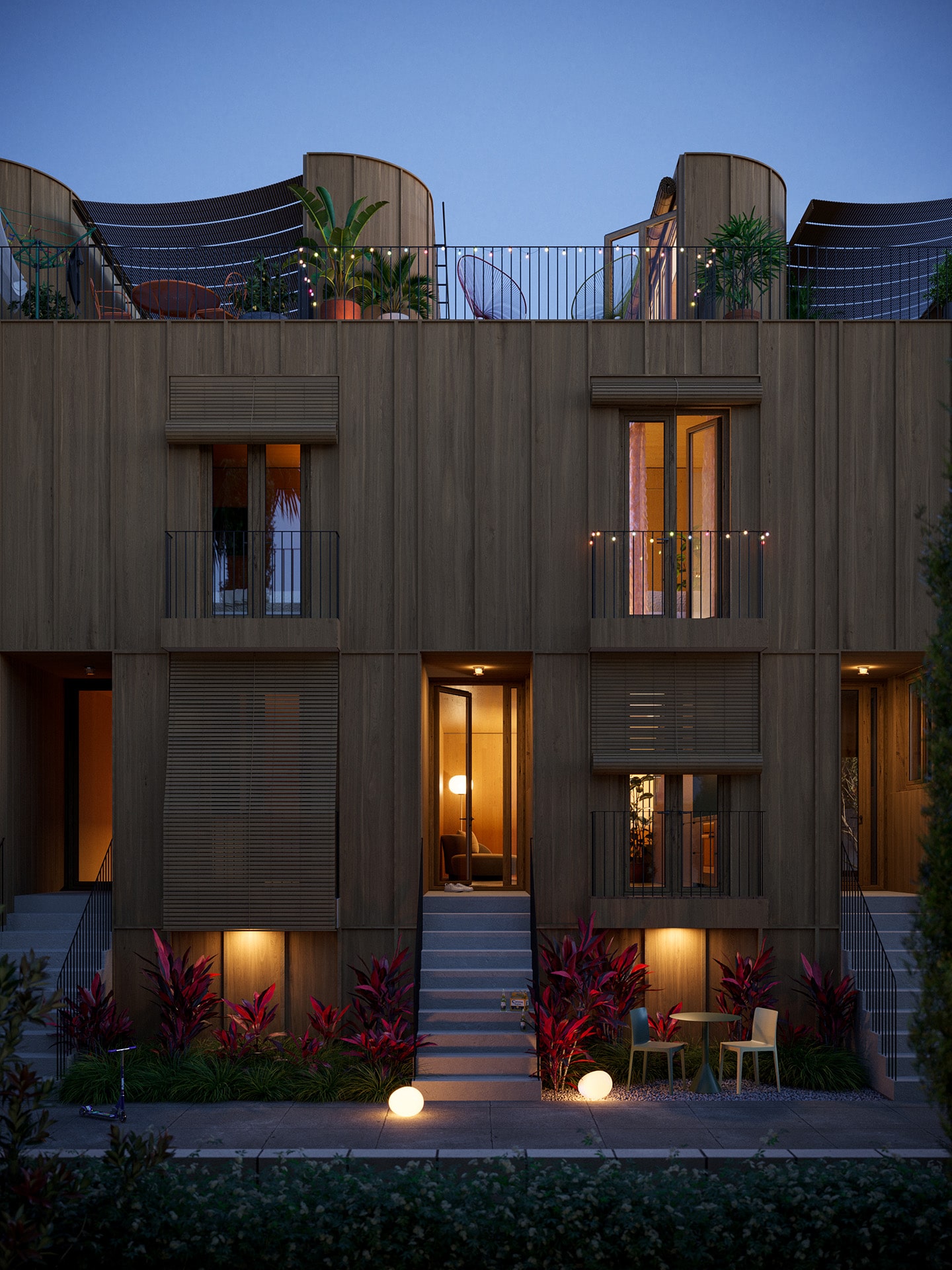 Rendering of the entrance side of Apt's standardized 6-unit residential building in Los Angeles, CA during twilight. Warm lights are on inside of the apartments, there's outdoor furniture set next to the porches. A door to one of the apartments is left open.